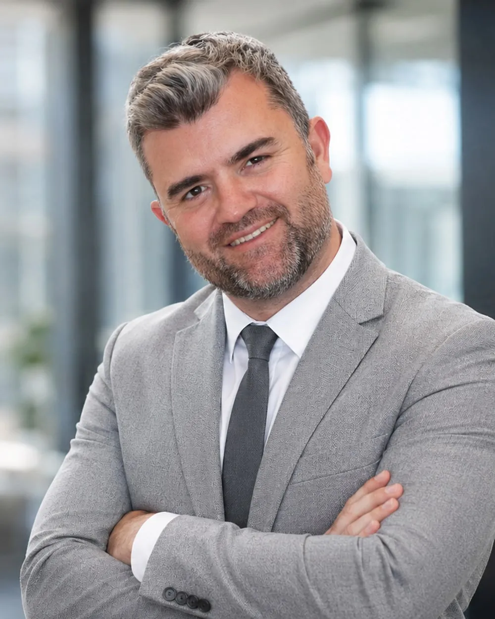 Anthony Garstang, Director at Vaultbook, in a grey suit at the Johannesburg office